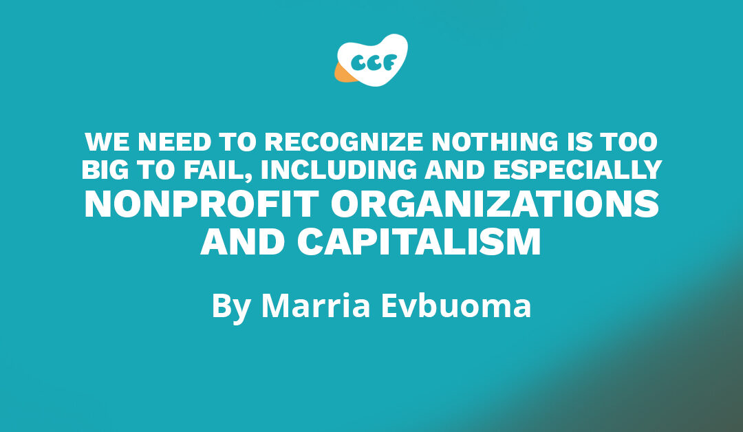 Banner says "We need to recognize nothing is too big to fail, including and especially nonprofit organizations and capitalism. By Marria Evbuoma"