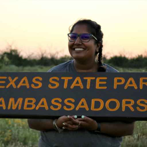 Rakhi holding a Texas State Park Ambassadors sign