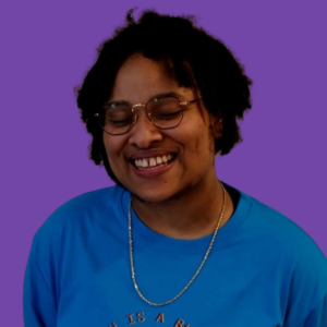 Headshot of Jasmine against a purple background