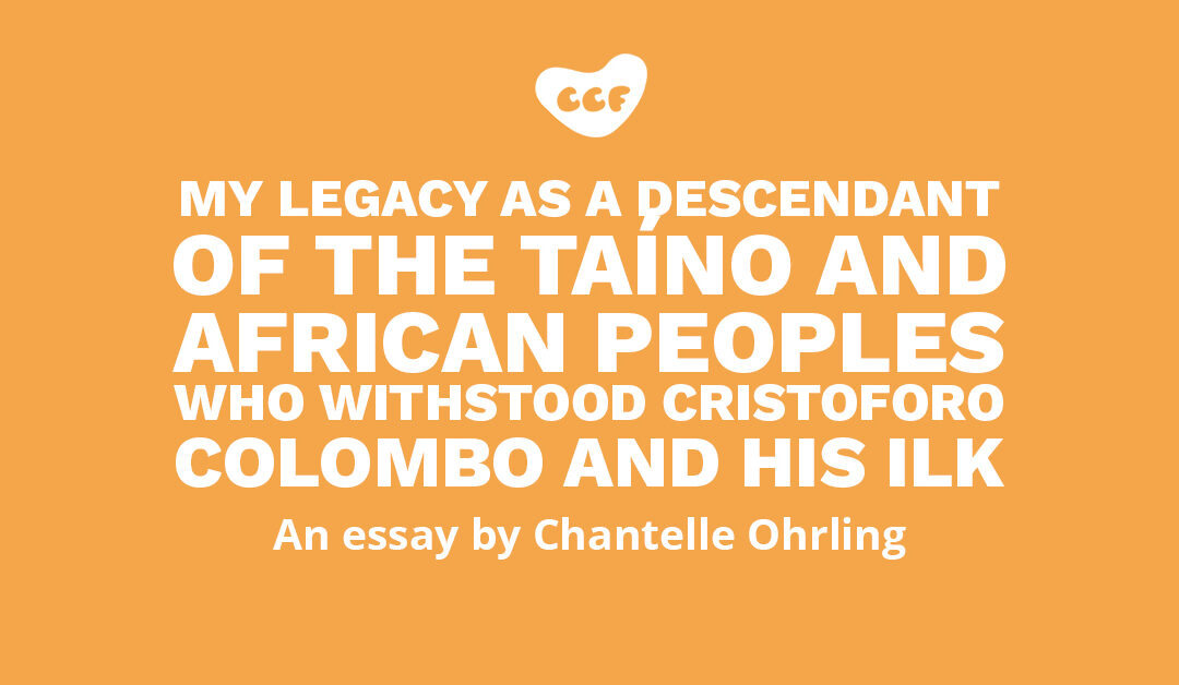 Banner says My legacy as a descendant of the Taíno and African peoples who withstood Cristoforo Colombo and his ilk. An essay by Chantelle Ohrling